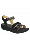 Sandalia de cuero negro para mujer, estilo informal, con taco plano y punta abierta para mayor confort.