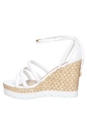 Sandalia casual de cuero blanco para mujer, con diseño moderno y taco cuña.