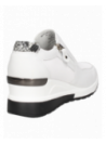 zapatilla blanca de cuero para mujer, diseño moderno y funcional con cremallera lateral, adecuada para ocasiones informales.