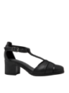 Calzado casual de cuero negro para mujer, con tacón medio grueso que ofrece estabilidad y comodidad prolongada.