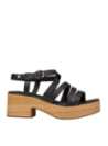 Sandalia negra de cuero para mujer con correas entrecruzadas, ideal para un estilo casual boho-chic y eventos al aire libre.