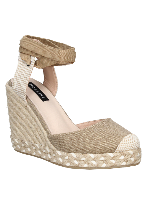 Alpargata beige boho-chic de cuña y plataforma de yute, ideal para un look casual y elegante.