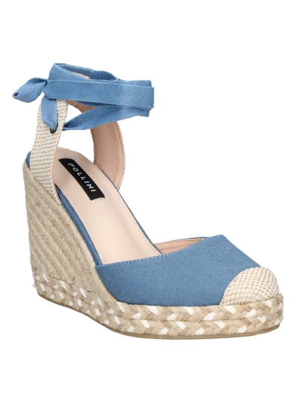 Alpargata negra de mujer con cuña y plataforma de yute trenzado, ideal para un estilo boho-chic.