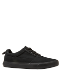 Zapatilla colegial negra unisex para niño con diseño minimalista, ideal para combinar con atuendos casuales y relajados.