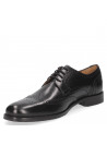 Zapato Oxford brogue de cuero negro para hombre, ideal para entrevistas y eventos profesionales.
