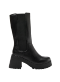 Bota de mujer negra, adecuada para días fríos o lluviosos, destaca por su estilo robusto y elegante en cuero y textil.