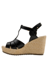 Sandalia de cuero negra para mujer, diseño casual con taco cuña, perfecta para salidas veraniegas.