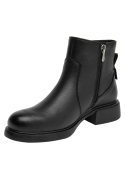 Botín negro de cuero, clásico hasta el tobillo, con suela moderada para buena amortiguación y estabilidad.