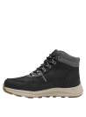 Calzado outdoor de cuero negro para mujer, ideal para terrenos irregulares, con suela gruesa y patrón de tracción.