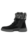 Calzado de cuero negro para mujer, con corte alto y cordones reforzados, diseñado para ofrecer soporte y protección.