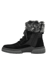 Calzado de cuero negro para mujer, con corte alto y cordones reforzados, diseñado para ofrecer soporte y protección.