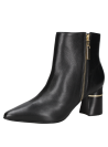 Botín negro de cuero para mujer, diseño elegante y minimalista, ideal para estilo casual con ajuste seguro hasta el tobillo.