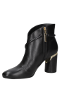 Botín negro de cuero para mujer, diseño sofisticado con tacón ancho y alto, perfecto para un estilo casual moderno.