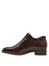 Zapato café de charol para mujer, con cremallera lateral en cuero, combina estilo moderno y comodidad urbana.