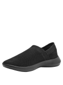 Zapatilla negra urbana para hombre, diseño slip-on textil, ideal para un look casual y relajado, minimalista y moderno.