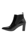 Botín Chelsea negro de cuero para mujer con diseño sofisticado, punta afilada y tacón que brinda estabilidad y comodidad.