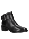 Botín negro de cuero para mujer, suela robusta y versátil, ideal para ocasiones formales y diarias.