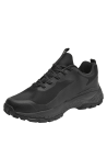 Zapatilla negra de trail running, suela optimizada para agarre en distintos terrenos, ideal para actividades al aire libre.