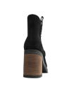 Botín de cuero negro estilo Chelsea para mujer, versátil para el uso diario, con un toque moderno y sofisticado.