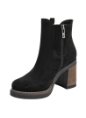 Botín Chelsea de cuero negro para mujer, ideal para estilo boho-chic, con detalles trenzados y taco cómodo.