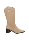 Bota vaquera de mujer en color beige, confeccionada en cuero 100%, ideal para ocasiones formales o casuales.