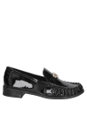 Mocasín clásico de cuero negro con diseño retro y chic, versátil para un estilo formal o casual arreglado.