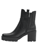 Elegante botín Chelsea negro de cuero, diseñado para mujer, combina con atuendos casuales y formales.