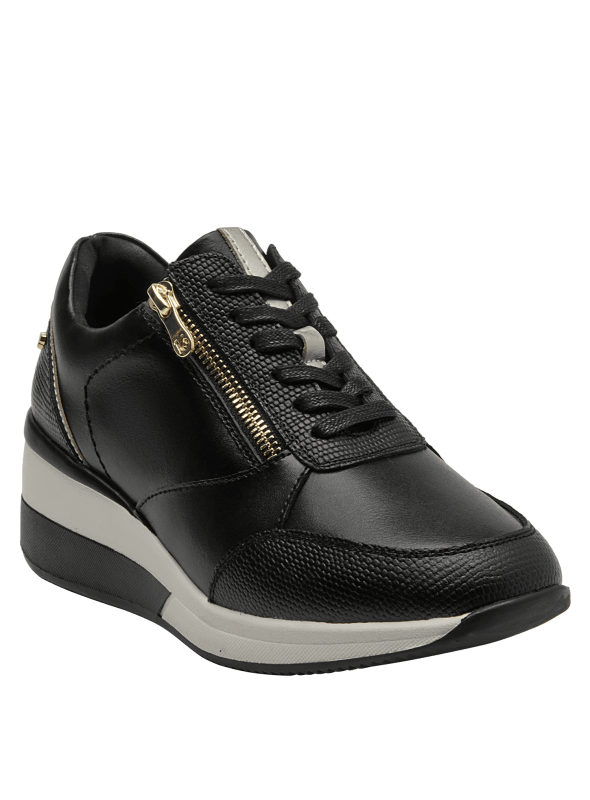 zapatilla estilizada de cuero negro para mujer, combinando comodidad y estilo deportivo con detalles funcionales.