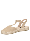 Alpargata mujer beige en cuero con diseño casual, punta cerrada y talón descubierto, estilo boho-chic con hebilla ajustable.