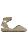 Cuero beige en alpargata femenina, diseño casual con suela de esparto para un look natural y desenfadado.