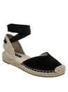 Elegante alpargata de cuero negro con punta cerrada, ideal para primavera-verano.