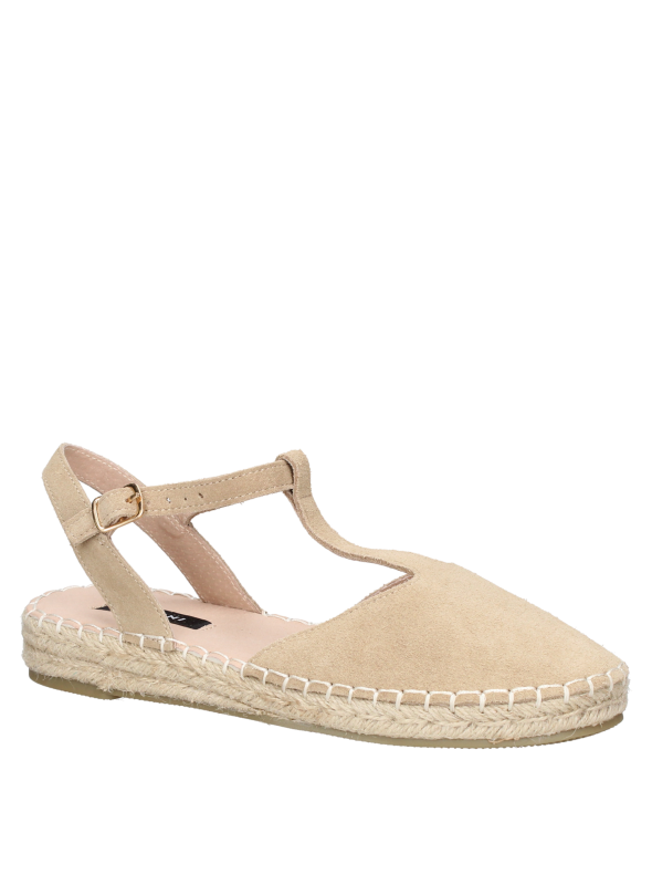 Suela artesanal de esparto en alpargata beige de cuero, combinable con faldas midi.