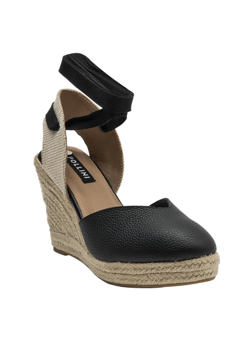 Alpargata casual de cuero negro, perfecta para salidas informales y eventos al aire libre.