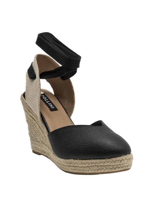 Alpargata casual de cuero negro, perfecta para salidas informales y eventos al aire libre.