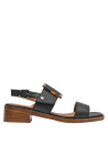 Sandalia minimalista de cuero negro con diseño cómodo y moderno, perfecta para paseos.