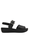 Calzado casual de cuero negro con hebilla grande, ideal para ocasiones informales y semi-formales.