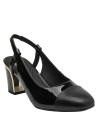 Zapato de mujer en charol negro con textura lisa y acabado brillante, estilo años 60.