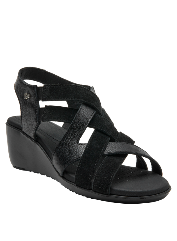 Sandalia de cuero negro, diseño elegante con detalles en gamuza y acabado mate.