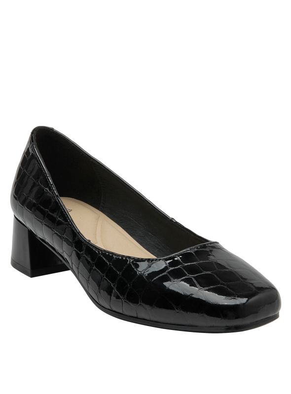Zapato de cuero negro con diseño clásico y tacón bajo, perfecto para oficina.
