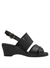 Sandalia negra de cuero con correa ajustable, perfecta para combinar con diversas prendas.