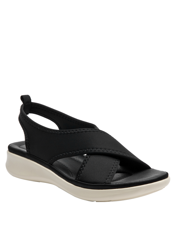 Sandalia deportiva negra de mujer con correas anchas cruzadas y suela blanca crema estilo plataforma.