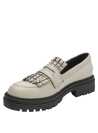 Calzado de cuero crema con suela negra contrastante, diseño vanguardista y elegante para mujer.