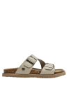 Sandalia de mujer en cuero beige, ideal para moda normcore y athleisure.