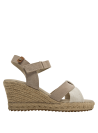 Tiras cruzadas en alpargata beige de cuero y lona, estilo casual para mujer.