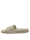 Sandalia casual beige con diseño elegante y suela plana para comodidad diaria.