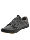 zapatilla monocromática de hombre estilo casual con cordones y suela de goma contrastante