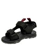 Calzado infantil negro con velcros ajustables y suela antideslizante, ideal para caminatas ligeras.