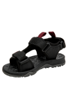 Calzado infantil negro con velcros ajustables y suela antideslizante, ideal para caminatas ligeras.
