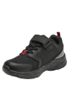 Zapatilla infantil negra con malla transpirable y suela moteada blanca, perfecta para uso urbano y deportivo.