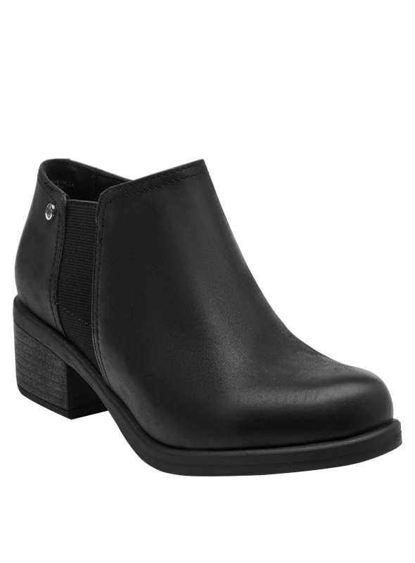 Botín de cuero negro, versátil para combinar con jeans, faldas o vestidos.